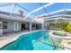Beautiful screened-in pool and spa area offering a private retreat, perfect for unwinding or entertaining guests at 3905 Trentwood Pl, Sarasota, FL 34243