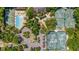 Aerial view of community pool, tennis courts, and well-manicured landscaping at 4044 Penshurst Park, Sarasota, FL 34235
