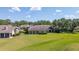 Back yard with green grass and patio at 4044 Penshurst Park, Sarasota, FL 34235