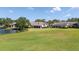 Backyard with lake and golf view at 4044 Penshurst Park, Sarasota, FL 34235