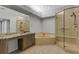 Bathroom with granite counter tops, shower and garden tub at 4044 Penshurst Park, Sarasota, FL 34235