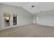 Bedroom with vaulted ceiling and glass doors leading to outdoor area at 4044 Penshurst Park, Sarasota, FL 34235