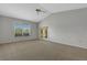 Bedroom with vaulted ceiling and glass doors leading to outdoor area at 4044 Penshurst Park, Sarasota, FL 34235