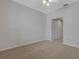 Cozy carpeted bedroom with a ceiling fan and double closets offering ample storage space at 4044 Penshurst Park, Sarasota, FL 34235