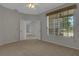 Bedroom featuring a window overlooking a porch and the neighborhood at 4044 Penshurst Park, Sarasota, FL 34235