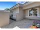 Charming courtyard with brick pavers, wrought iron gate, and beautiful landscaping, offering private outdoor space at 4044 Penshurst Park, Sarasota, FL 34235