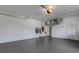 Spacious two car garage features a sealed floor and high ceilings for storage and parking convenience at 4044 Penshurst Park, Sarasota, FL 34235