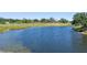 Lake view with golf course at 4044 Penshurst Park, Sarasota, FL 34235