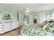 Inviting bedroom featuring wood floors, ample storage space, and calming decor at 4312 14Th E St, Ellenton, FL 34222