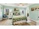 Comfortable bedroom boasts natural light, wood flooring, and soothing decor at 4312 14Th E St, Ellenton, FL 34222