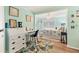 Bright bedroom with a desk setup and a comfortable bed, with blue and floral patterns at 4312 14Th E St, Ellenton, FL 34222