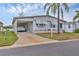 Inviting single-story home with covered carport, concrete driveway, and well-maintained lawn at 4312 14Th E St, Ellenton, FL 34222