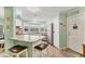 Bright kitchen featuring stainless steel appliances, white cabinets, breakfast bar, and a window over the sink at 4312 14Th E St, Ellenton, FL 34222