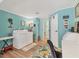 Cozy laundry room, complete with washer, dryer, and folding table at 4312 14Th E St, Ellenton, FL 34222