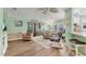 Light and airy living room with beach-themed decor, wood flooring, and sliding door at 4312 14Th E St, Ellenton, FL 34222