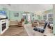 Inviting living room with a decorative fireplace, wood flooring, and comfortable seating at 4312 14Th E St, Ellenton, FL 34222