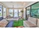Relaxing sunroom filled with comfortable seating, a ceiling fan, and plenty of natural light at 4312 14Th E St, Ellenton, FL 34222