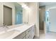 Modern bathroom featuring a double sink vanity with quartz countertop and a walk-in shower at 4324 Sea Marsh Pl, Parrish, FL 34219