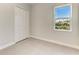 Bright bedroom featuring a large window and a double door closet at 4324 Sea Marsh Pl, Parrish, FL 34219