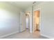 Empty bedroom showcasing a neutral color scheme and doorways to other rooms at 4324 Sea Marsh Pl, Parrish, FL 34219