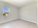 Empty bedroom featuring tile floors, a window, and a closet at 4324 Sea Marsh Pl, Parrish, FL 34219