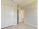 Neutral bedroom with tiled floor and a closet, offering a blank canvas at 4324 Sea Marsh Pl, Parrish, FL 34219