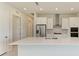 Modern kitchen featuring white cabinets, stainless steel appliances, and a large center island at 4324 Sea Marsh Pl, Parrish, FL 34219