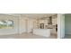 Bright and airy kitchen features white cabinets and a center island at 4324 Sea Marsh Pl, Parrish, FL 34219