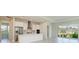 Modern kitchen with white cabinets, stainless steel appliances, and a large island at 4324 Sea Marsh Pl, Parrish, FL 34219