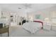 Well-lit bedroom with ample natural light, neutral carpet, and a ceiling fan at 4360 Presidential Avenue E Cir, Bradenton, FL 34203