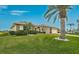 Inviting single-story home showcasing lush green lawn and mature landscaping at 4360 Presidential Avenue E Cir, Bradenton, FL 34203