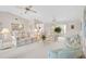 Open-concept living room with comfortable furnishings, ceiling fans, and a bay window at 4360 Presidential Avenue E Cir, Bradenton, FL 34203