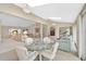 Open-concept sun room shows access to the living room and features great natural light and vaulted ceilings at 4360 Presidential Avenue E Cir, Bradenton, FL 34203