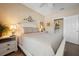 Cozy bedroom with neutral tones, a white bed frame, and a glimpse of a closet at 4802 51St W St # 1908, Bradenton, FL 34210