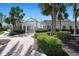 Charming community clubhouse with well-manicured landscaping and inviting walkway at 4802 51St W St # 1908, Bradenton, FL 34210