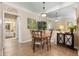 Dining room with wood floors, modern table set, and decorative mirror creating a stylish space at 4802 51St W St # 1908, Bradenton, FL 34210