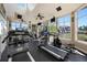 Community fitness center featuring treadmills and elliptical machines with ample natural light at 4802 51St W St # 1908, Bradenton, FL 34210