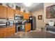 Kitchen features stainless steel appliances, oak cabinets, and neutral countertops at 4802 51St W St # 1908, Bradenton, FL 34210