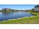 Expansive view of the community pond complete with fountain and surrounding apartments at 4802 51St W St # 1908, Bradenton, FL 34210