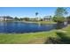 Scenic view of a tranquil pond with lush green surroundings in a beautiful community at 4802 51St W St # 1908, Bradenton, FL 34210
