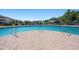 Community pool with brick pavers and lounge chairs surrounded by well maintained landscaping at 4802 51St W St # 1908, Bradenton, FL 34210