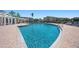 Resort-style pool surrounded by lounge chairs and lush landscaping at 4802 51St W St # 1908, Bradenton, FL 34210