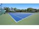 Well-maintained tennis court with a blue and green surface and perimeter fencing at 4802 51St W St # 1908, Bradenton, FL 34210