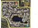 Aerial view of The Palms of Cortez community featuring a pond, pool and tennis courts at 4802 51St W St # 704, Bradenton, FL 34210