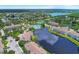 A beautiful aerial shot shows the complex featuring multiple lakes, tennis courts, and lush greenery at 4802 51St W St # 704, Bradenton, FL 34210