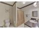 A full bathroom is displayed with decorative accents and neutral color palette at 4802 51St W St # 704, Bradenton, FL 34210