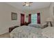 This cozy bedroom features two twin beds, matching dressers, and light-filled windows at 4802 51St W St # 704, Bradenton, FL 34210