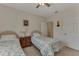 Comfortable bedroom with twin beds, ceiling fan and convenient access to closets and entryways at 4802 51St W St # 704, Bradenton, FL 34210