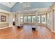 Open clubhouse area features laminate wood floors and multiple windows overlooking the outdoor pool at 4802 51St W St # 704, Bradenton, FL 34210