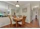 Inviting dining room featuring a round table with seating for four and mirrored wall accents at 4802 51St W St # 704, Bradenton, FL 34210